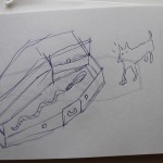 Rough sketch of an open treasure chest and a cat on a plain notebook page.