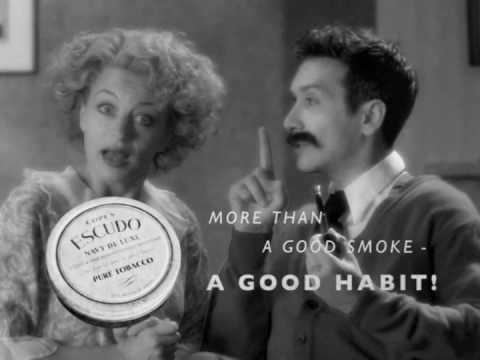 A vintage black and white advertisement featuring a man and a woman, with the man holding a tin of tobacco and text promoting it as 'more than a good smoke - a good habit!.