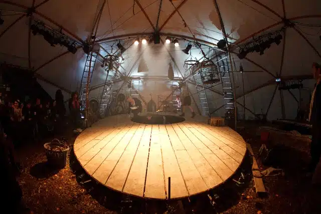 An empty lit stage in a dome like structure