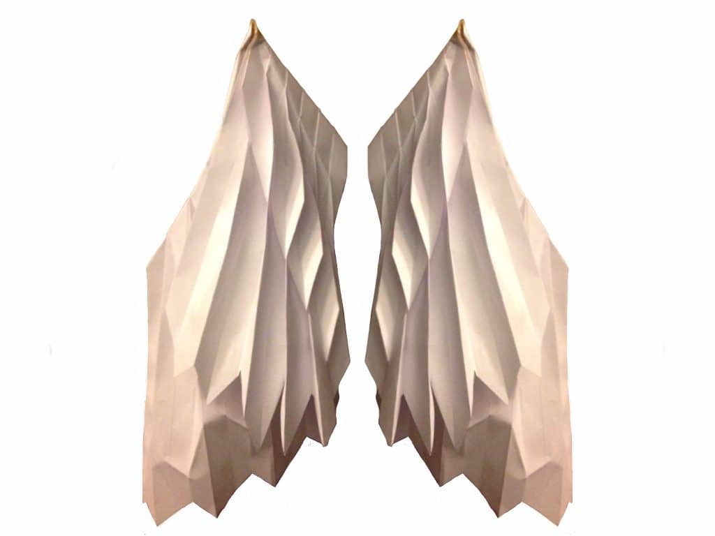 A pixelated image of two beige paper wings against a plain white background.