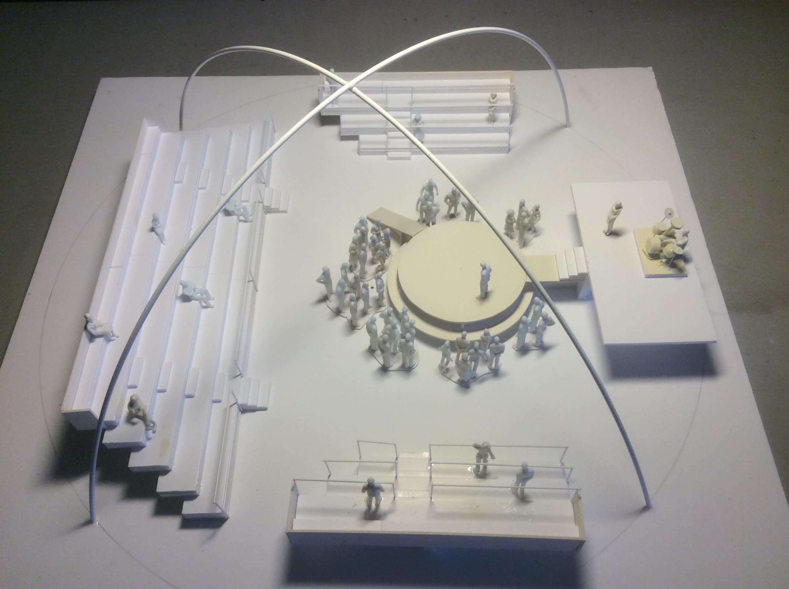Photograph of set design model for Kneehigh's Ubu. White scale model for stage/set design. Containing model figures and seating configuration.