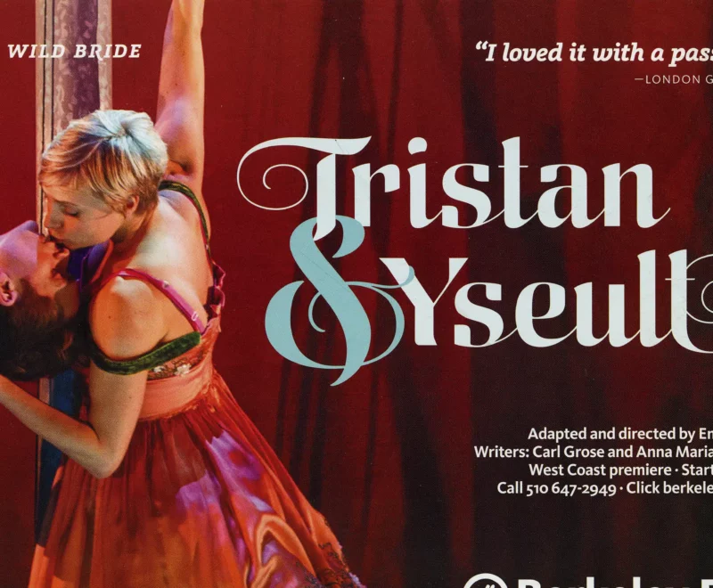 The image is the front side of a flyer for Kneehigh's performance of Tristan and Yseult at Berkeley Rep. It features the main characters, Tristan and Yseult, in a romantic embrace. The women is dressed in a red dress with floral details and has short blonde hair. She is holding on to the back of the mans neck, who is bending over backwards to kiss the woman. Both figures are holding onto a prop out of frame to support them. To the right of the two figures is the title 'Tristan & Yseult' in a cursive font. There are details about the venue and production in small white font underneath.