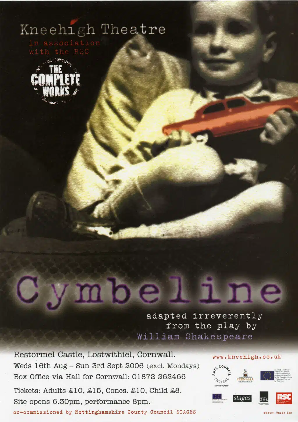 This image is a poster for Kneehigh's performance of Cymbeline at Restormel Castle running from Wednesday 16th August to Sunday 3rd September 2006. The image depicts a faded photo of a young boy holding a bright red toy car in the mid to top left of the image. The top right features the Kneehigh Theatre logo in a black typewriter font and the words 'in association with the RSC' in smaller red font. The bottom half of the poster features the title 'Cymbeline' in a glowing purple font. Underneath written in small white text reads 'adapted irreverently from the play by William Shakespeare'. Below this is black text on a white background with information about the dates, location and price of performances.