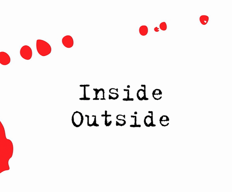 Abstract red ink blot with a gradient of droplets, juxtaposed with the words 'inside outside.'.