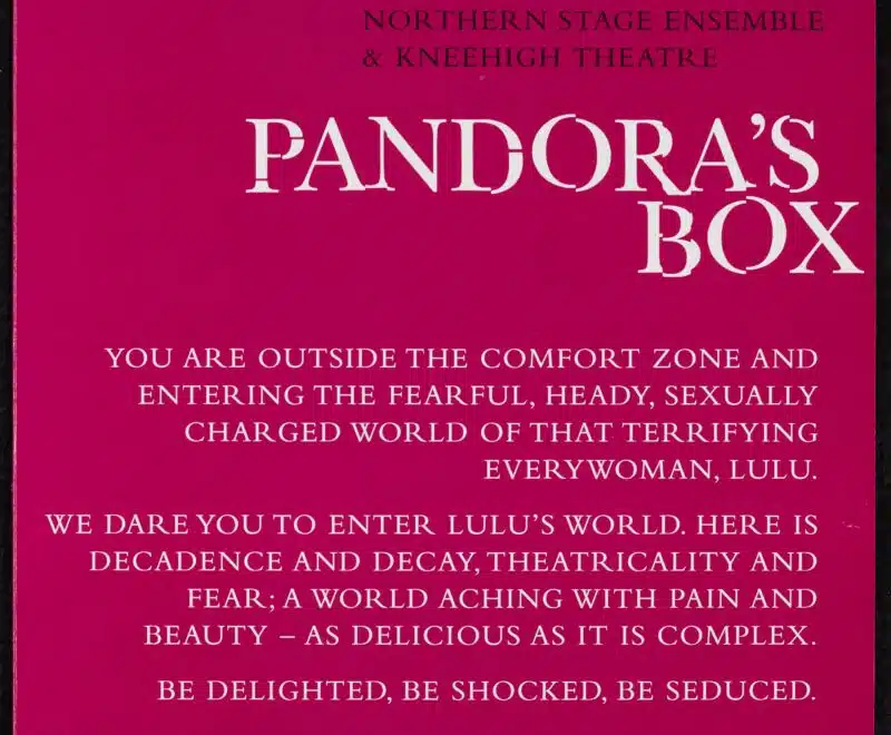 The image features a block of white text set against a dark pink backdrop. The production title reading 'Pandora's Box' is presented in the top right in a larger white font. The block of smaller white text reads 'You are outside the comfort zine and entering the fearful, heady, sexually charged world of that terrifying everywoman, Lulu. We dare you to enter Lulu's world. Here is decadence and decay, theatricality and fear; a world aching with pain and beauty - as delicious as it is complex. Be delighted, be shocked, be seduced. Lulu would expect no less.