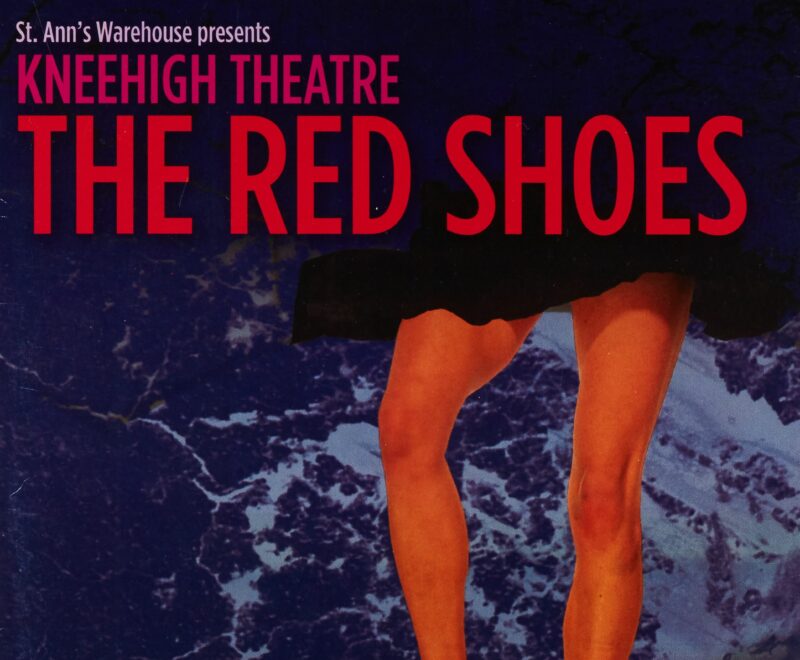 Contains a digitally altered image of a performer from the waist down wearing a pair of red leather shoes standing on top of a wooden stool. This is set against the backdrop of a wavey ocean backdrop. Text reading 'The Red Shoes' is presented on the top of the image in bold red text. Semi translucent text reading St. Ann's Warehouse' was presented on the bottom of the page.