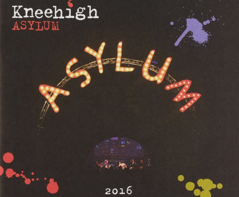 The image features the Asylum banner in bright neon lights in a arching semi circle pattern. There are three coloured paint splatters in the corners of the cover. The Kneehigh logo in a typewriter font is presented in the top right.